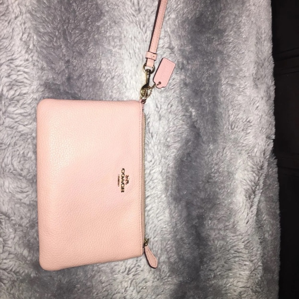 Rose colored Coach wristlet